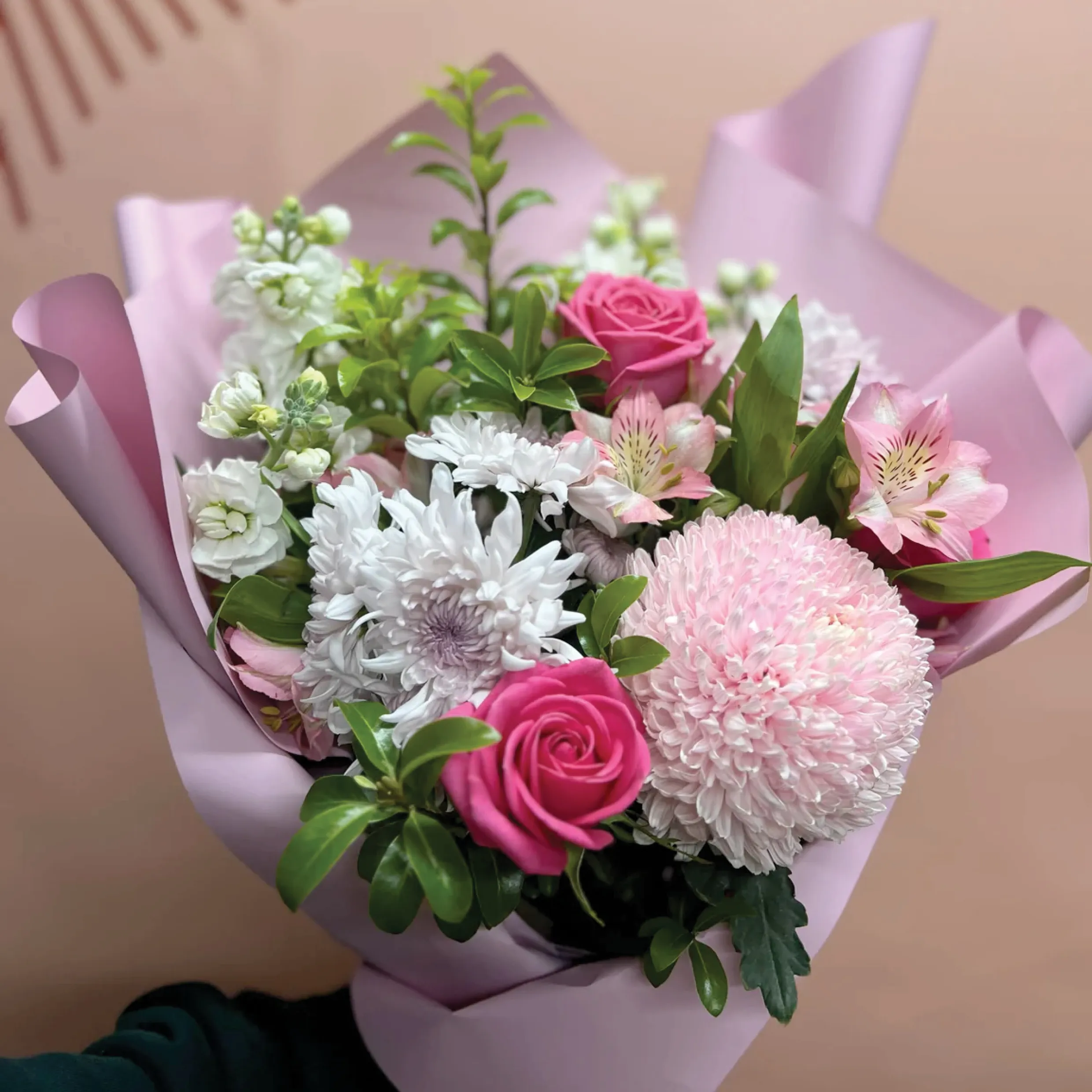 A fresh bouquet of white, pink, and purple flowers